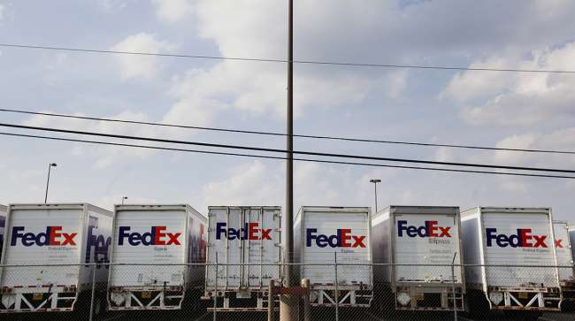 FedEx Corp. trucks sit lined up in a parking lot of the company's ship center near the Memphis International Airport in Memphis, Tenn.