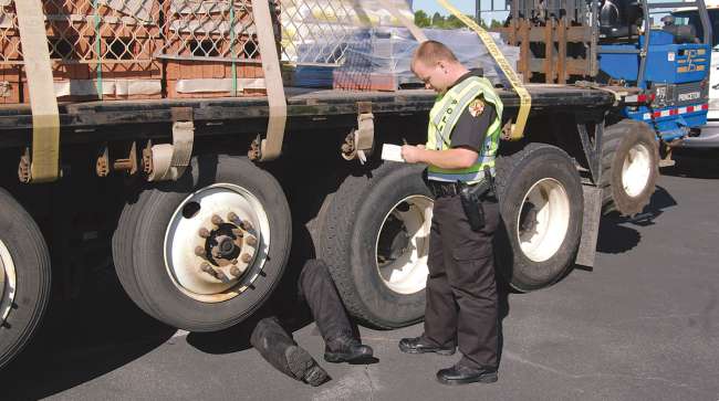 Inspectors checking a truck