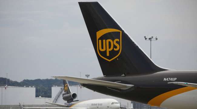 A UPS logo is displayed on the tail of a cargo jet at the company's Worldport facility in Louisville, Ky.