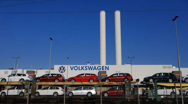 New Volkswagen Passat automobiles are transported on a railway vehicle carrier outside the inactive VW automobile factory in Zwickau, Germany, on April 2.